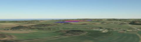 Modelled distant view in the 3D terrain model across a wide agricultural landscape, with the planned module areas marked in colour on the horizon