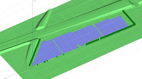 3D scene of a ground-mounted photovoltaic system in PVsyst: module tables on the terrain model, rows of trees at the edge as shading objects
