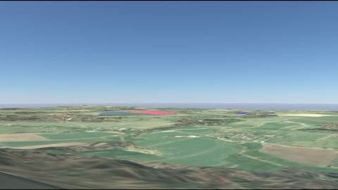 Modelled distant view across a wide agricultural landscape, with the installation areas as coloured areas near the horizon